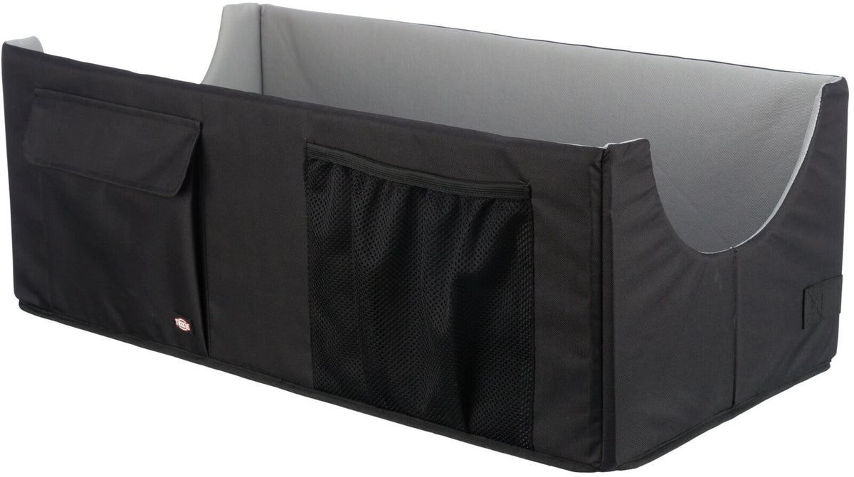 Schwarze, rechteckige Box mit grauem Innenraum, zwei Netz- und einer Klapptasche an der Seite.