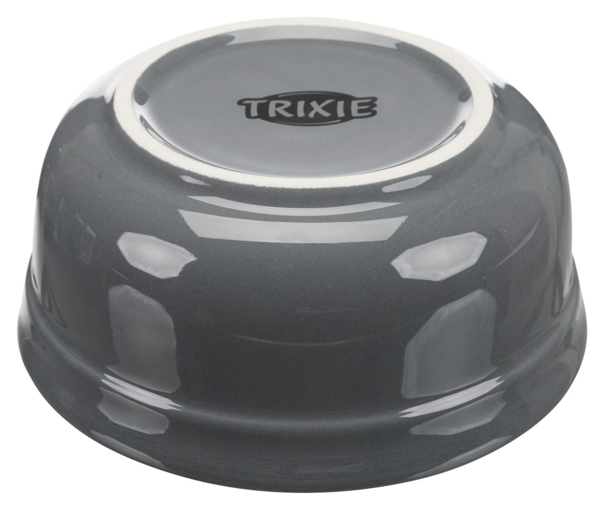 Graue Schüssel mit spiegelnder Oberfläche und dem Text "TRIXIE" auf der Unterseite, umgedreht aufgestellte.