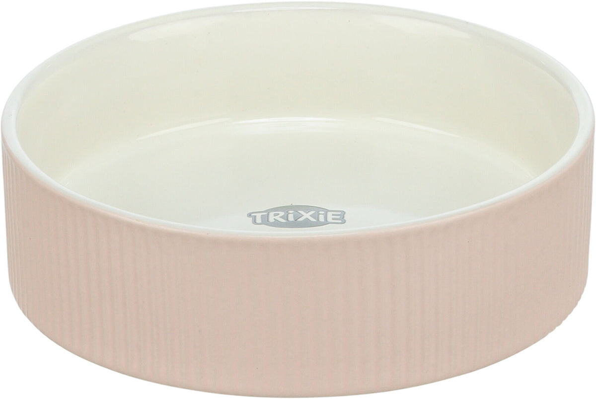 Runde, rosa Schale mit geriffelter Oberfläche und weißem Innenbereich, Marke "Trixie" sichtbar innen.