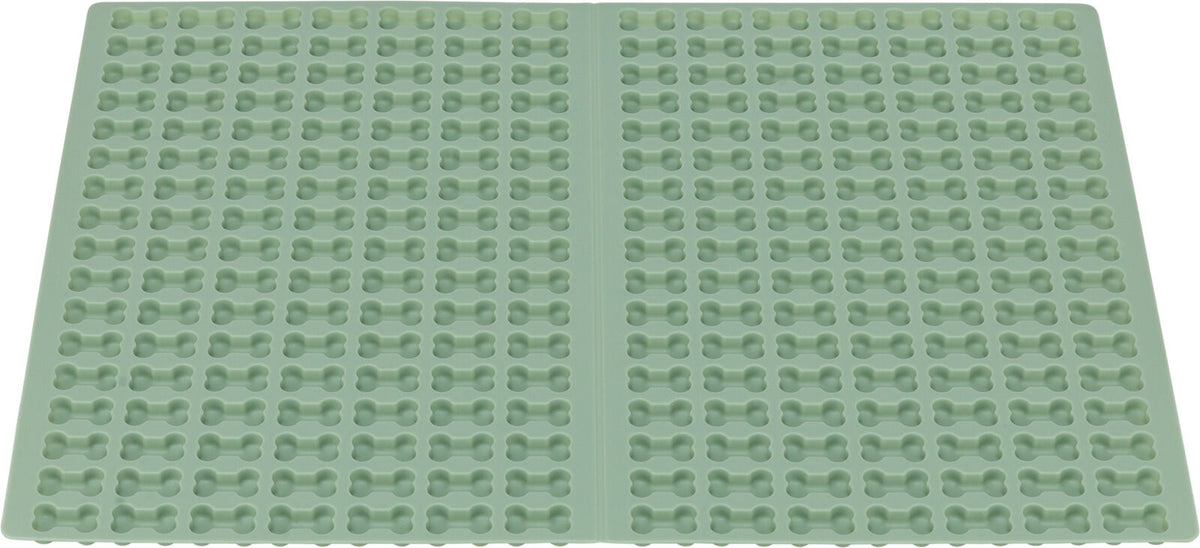 Grüne Silikonform mit regelmäßigen Knochenformenreihen über die gesamte Fläche verteilt.