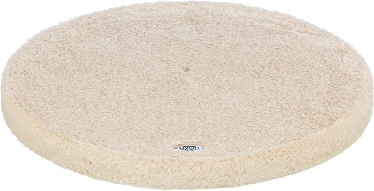 Rundes, beiges, flauschiges Kissen mit eingeprägtem Logo "Trixie" an der Unterseite, Oberfläche samtig.