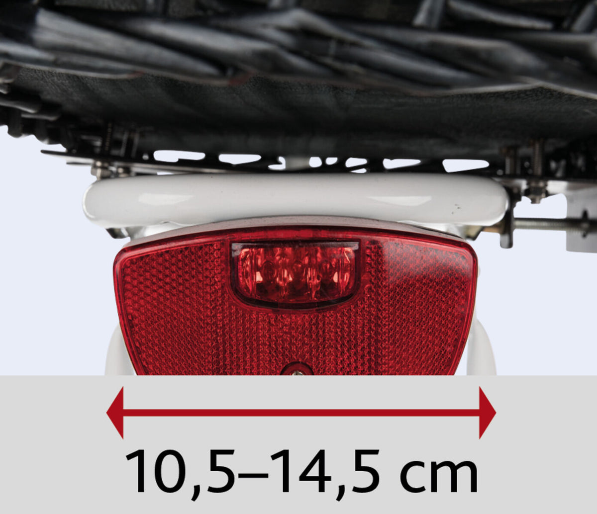 Rotes Rücklicht mit schwarzem Rahmen und Maßangabe von 10,5 bis 14,5 cm, gezeigt mit rotem Doppelpfeil.