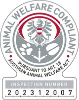 Stempel mit Adler, Tierpfoten und Text "Animal Welfare Compliant", Inspektionsnummer 202312007, in Grau und Rot.