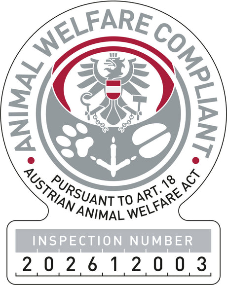 Siegel mit Adler, Pfotenabdruck, und Text "Animal Welfare Compliant, Pursuant to Art. 18 Austrian Animal Welfare Act," Inspektionsnummer 202612003.
