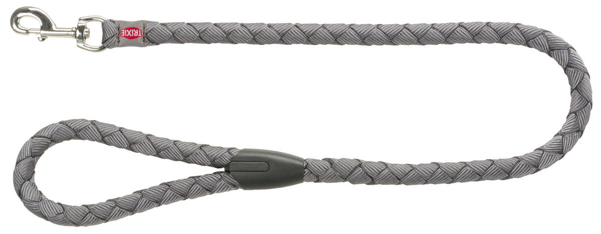 Geflochtene graue Hundeleine mit silbernem Karabiner und schwarzer Verstärkung, Text "TRIXIE" auf Etikett sichtbar.