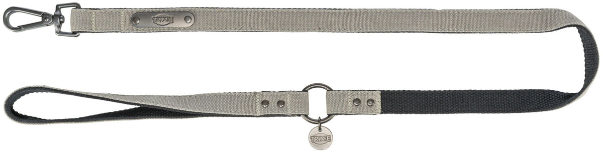 Beige und schwarze Hundeleine mit Metallverschluss und Markenplakette, versehen mit „TRIXIE“-Schriftzug.