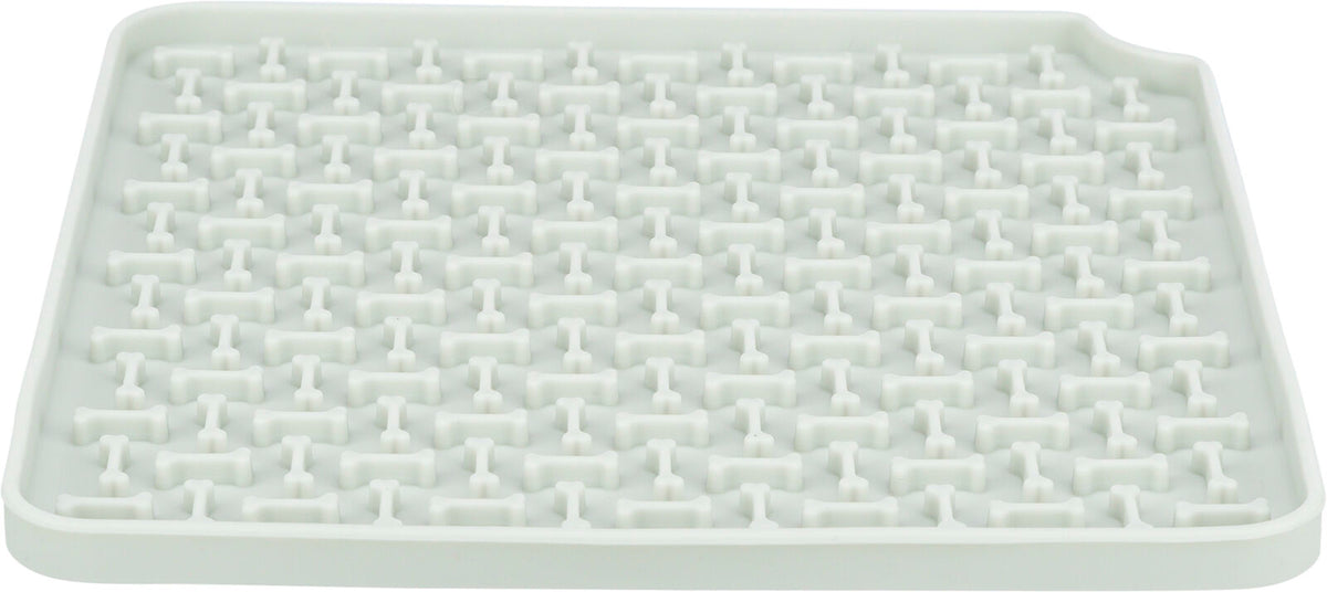 Weiße Kunststoffmatte mit erhöhtem Knochenmuster in einem rechteckigen Design.