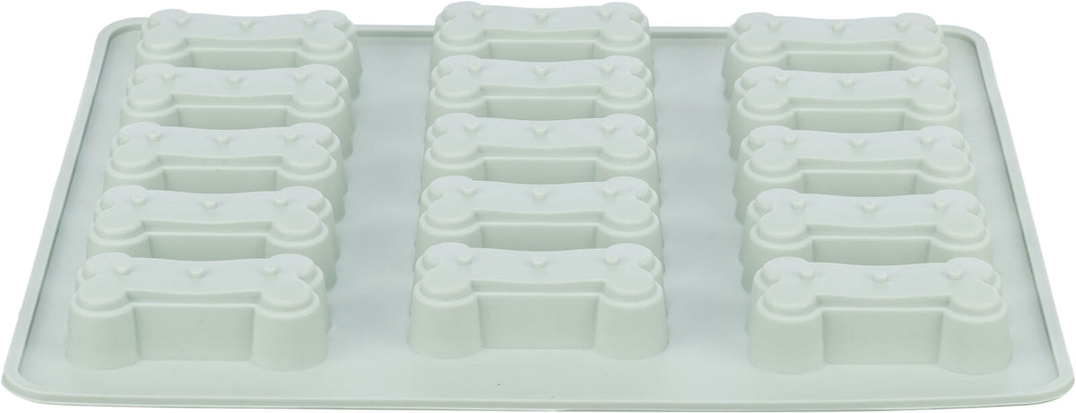 Weiße Silikonform mit zwölf Knochenformen in vier Reihen, verwendet für Backen oder Eiswürfel.