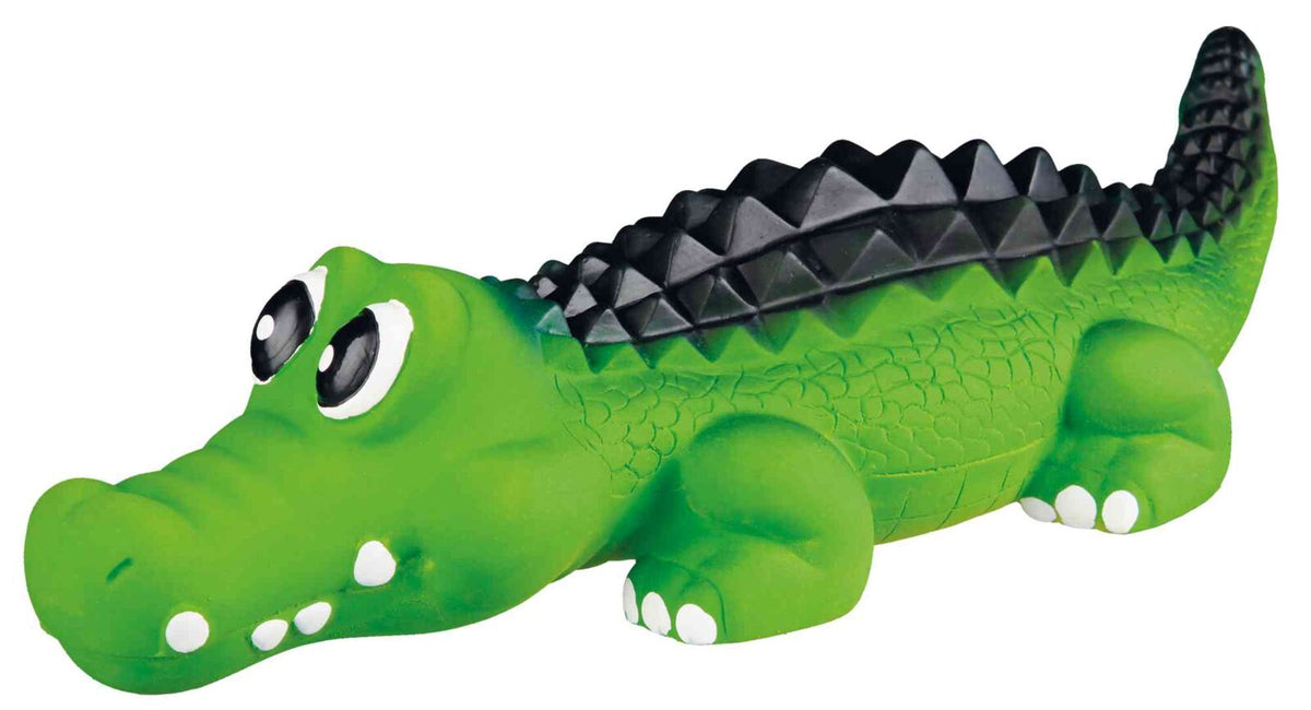 Grünes Krokodil-Spielzeug mit großen Augen und schwarzem, gezacktem Rücken.