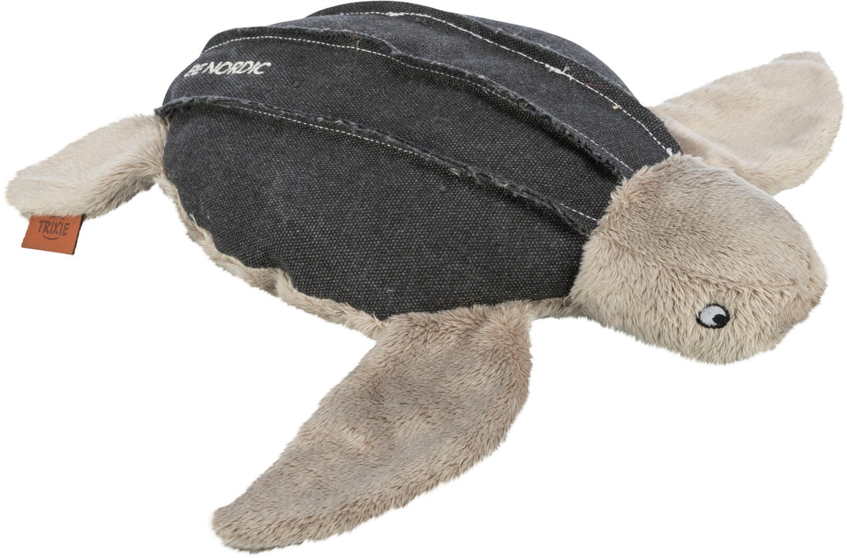 Plüschspielzeug in Form einer Schildkröte mit weichen, beigen Flossen und einem dunklen Panzer.