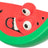 Rote und grüne Wassermelonenscheibe in Comic-Stil, mit großen Augen und offenem Mund, schwarze Kerne sichtbar.