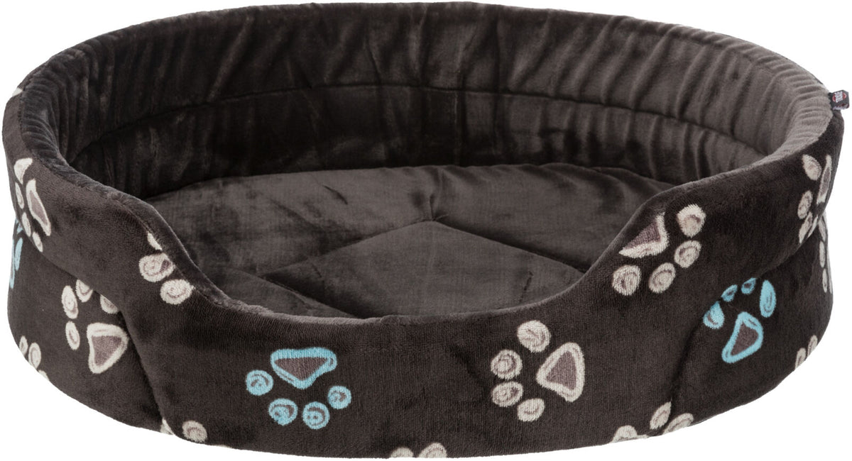 Rundes, gepolstertes Tierbett in Dunkelgrau mit bunten Pfotenmustern in Blau und Weiß.