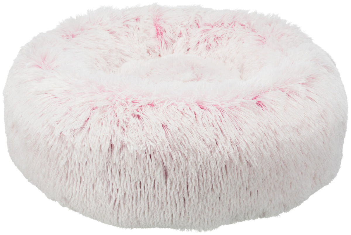 Helles, rundes, flauschiges Bett mit rosa und weißen langen Haaren.