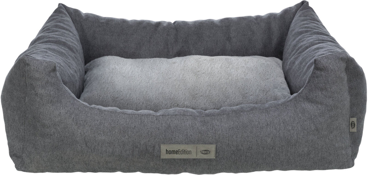 Graues, rechteckiges Hundebett mit hohem Rand und weicher, hellgrauer Liegefläche, „homeEdition“-Label sichtbar.