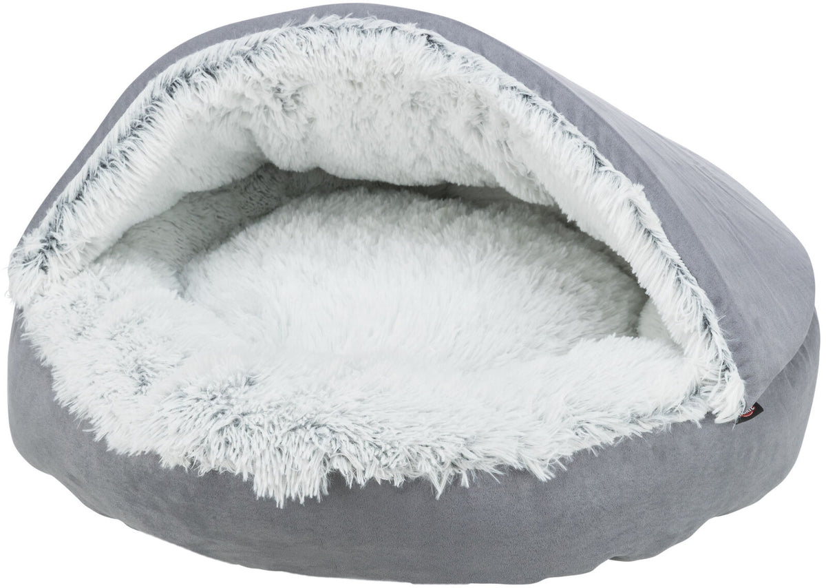 Rundes, graues Bett mit flauschigem weißen Innenfutter, halbrund überdacht, vermutlich für Haustiere.