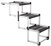 Zusammenklappbare, schwarz-graue Treppe mit drei Stufen, größtenteils aus Metall mit rutschfesten Stufenflächen.