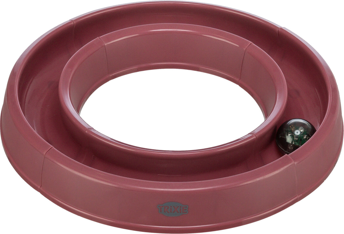 Roter, runder Spielzeugring mit einer kleinen Kugel im Inneren, sichtbar mit "Trixie" Logo.