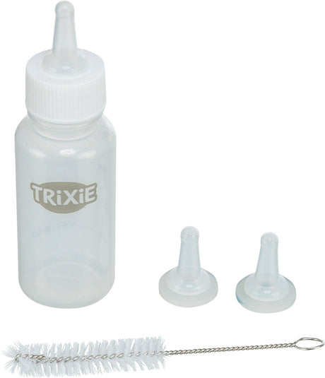 Transparente Flasche mit Aufschrift "Trixie", zwei weiße Sauger und eine weiße Reinigungsbürste.