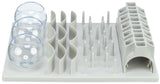 Kombination aus grauen Plastikstrukturen mit Kugeln, Wellen, Stäben und einer röhrenförmigen Öffnung.