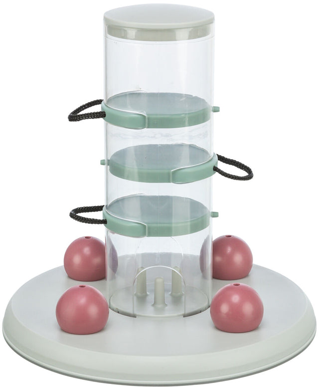 Durchsichtige, zylindrische Vorrichtung mit grünen Halterungen und vier rosa Kugeln auf runder, weißer Basis.